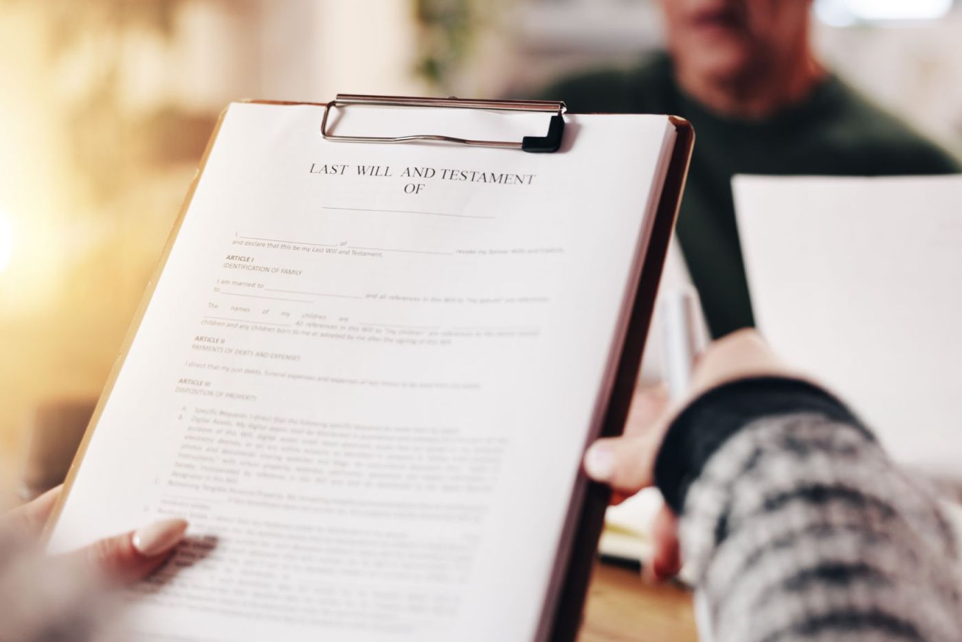 Woman holding last will and testament